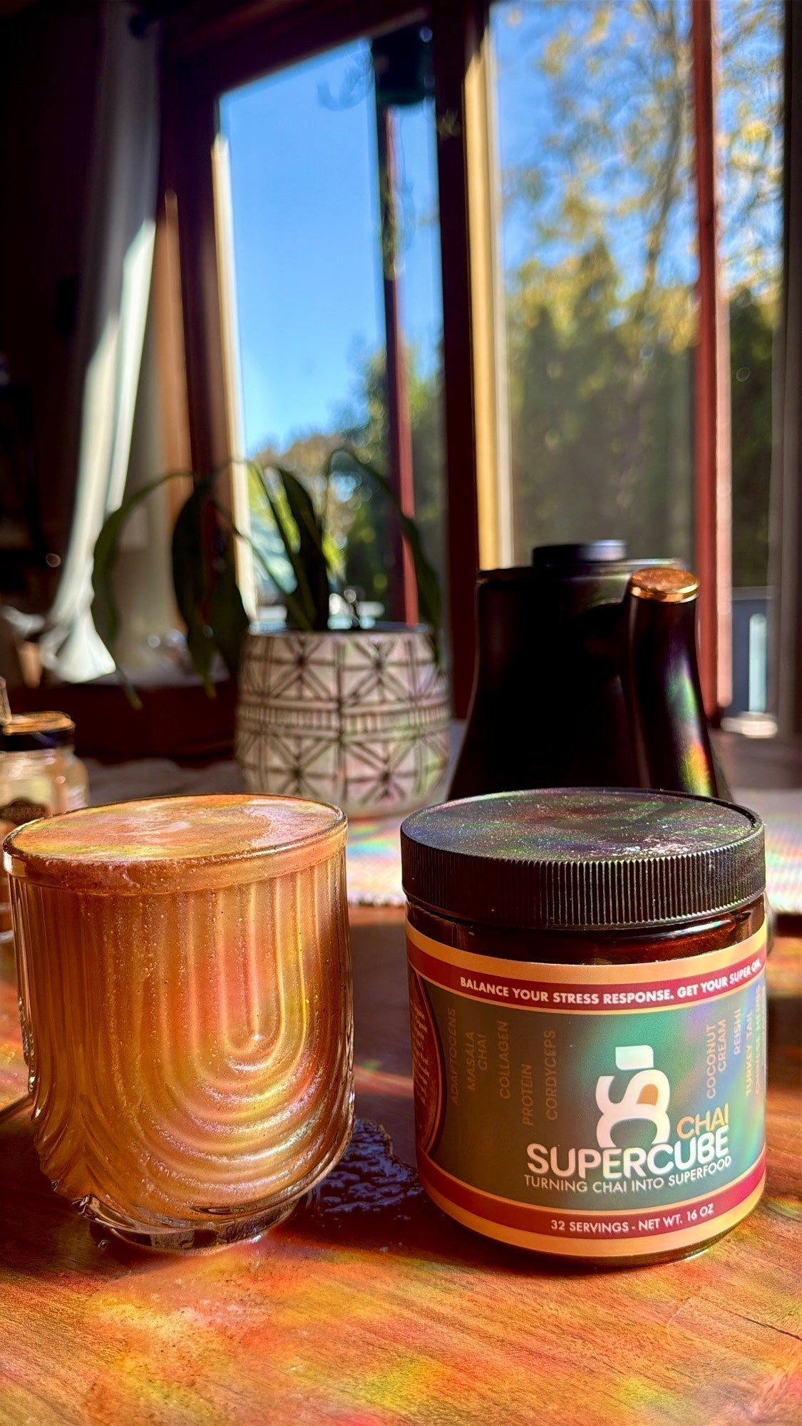 chai on a kitchen table with a jar of supercube chai next to it